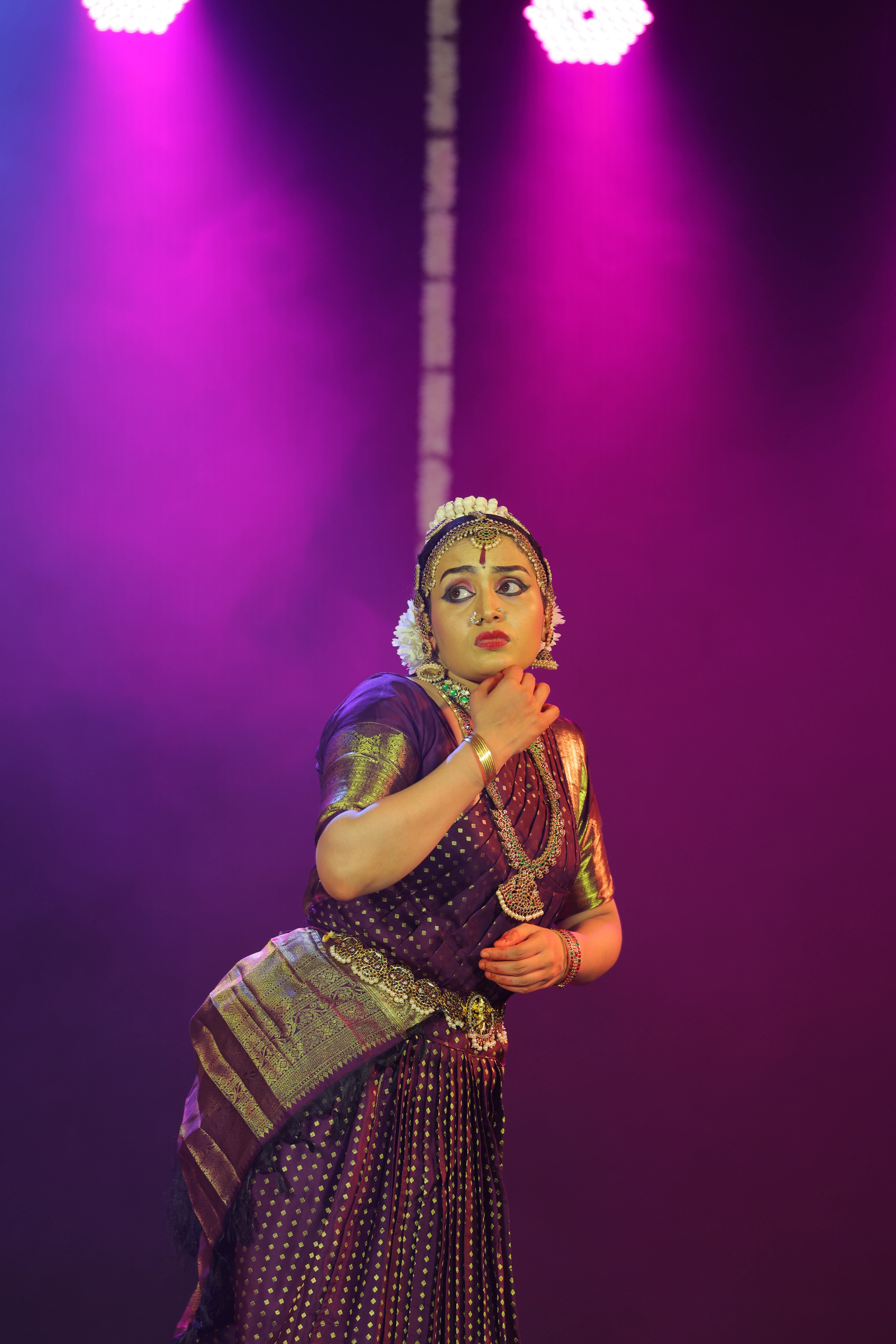Sherin Jose in recital costume under stage lighting